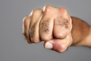 Hairy Man Fist Closeup Expression Over Gray